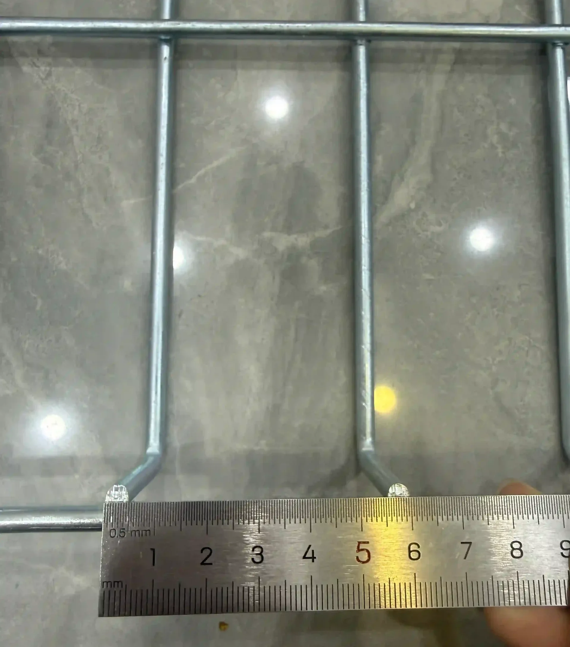 5.0mm wire diameter of wire mesh decking measured with a ruler