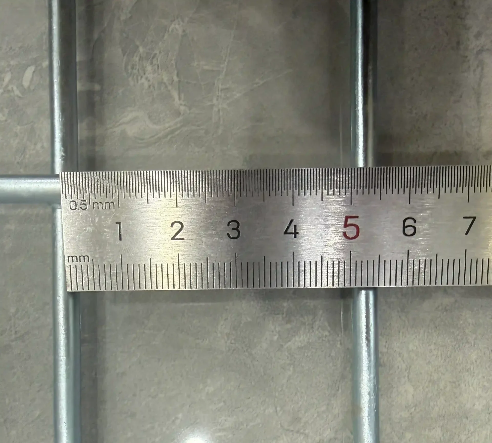 50mm mesh opening of wire mesh decking measured with a ruler